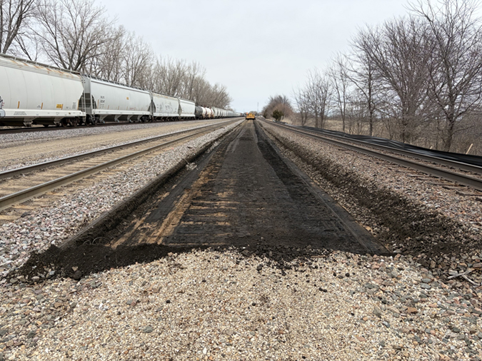 At top, a southbound view of grading work; at bottom, a northbound view
